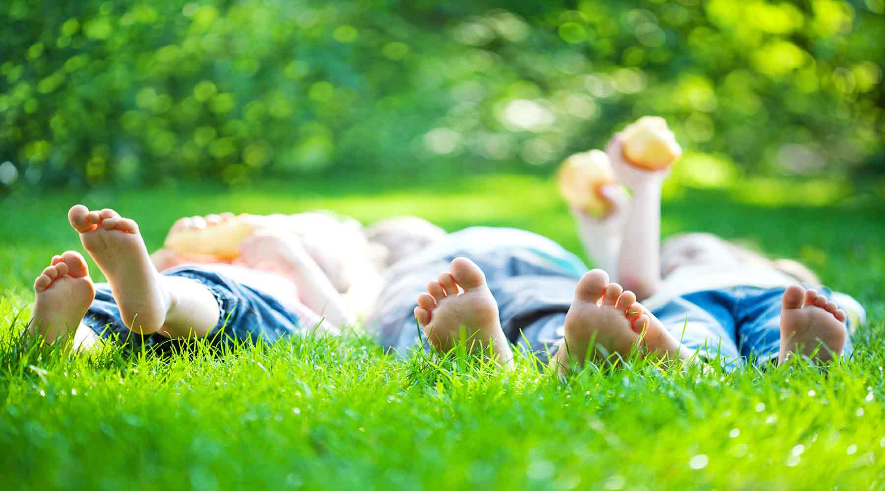 A family lying on the grass