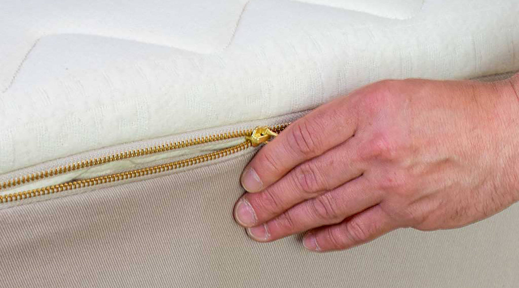 Natural Mattress Cover being Unzipped