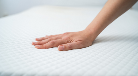 Hand on a mattress