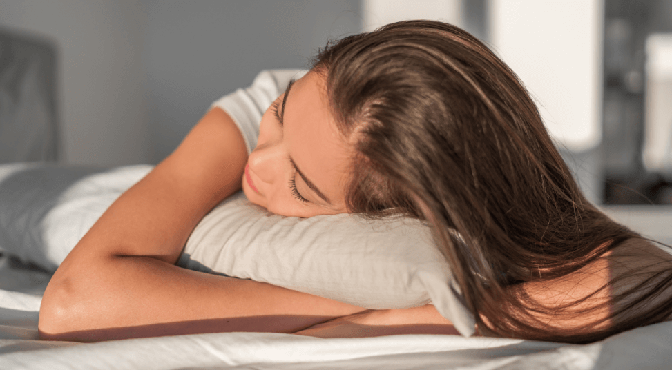 Woman sleeping on a mattress