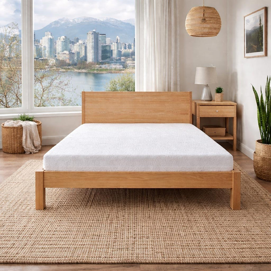 Low Cost Latex Mattress on Bed Frame with Vancouver skyline in back. 